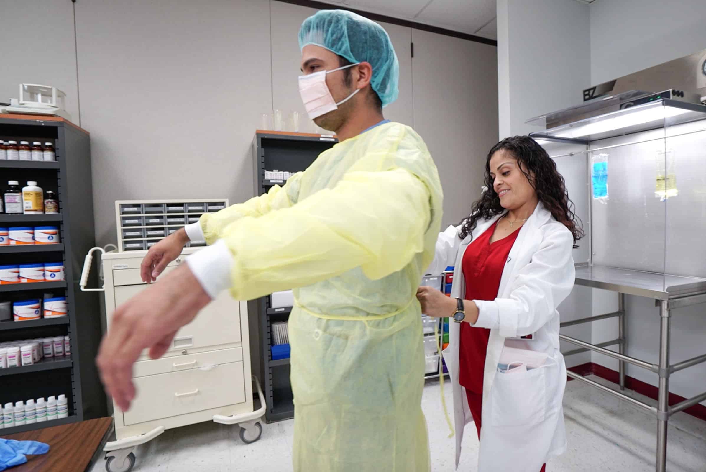miami pharmacy technician training - student practicing in the FVI pharmacy lab with an instructor