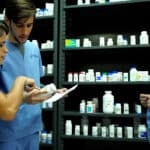 Miami Pharmacy technician program students practicing in FVI's pharmacy lab