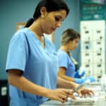 Miami pharmacy technician training: student working with measurements