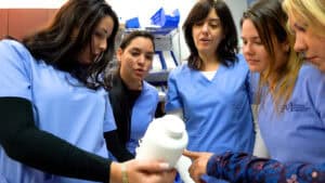 Miami pharmacy tech training: student putting away medicine
