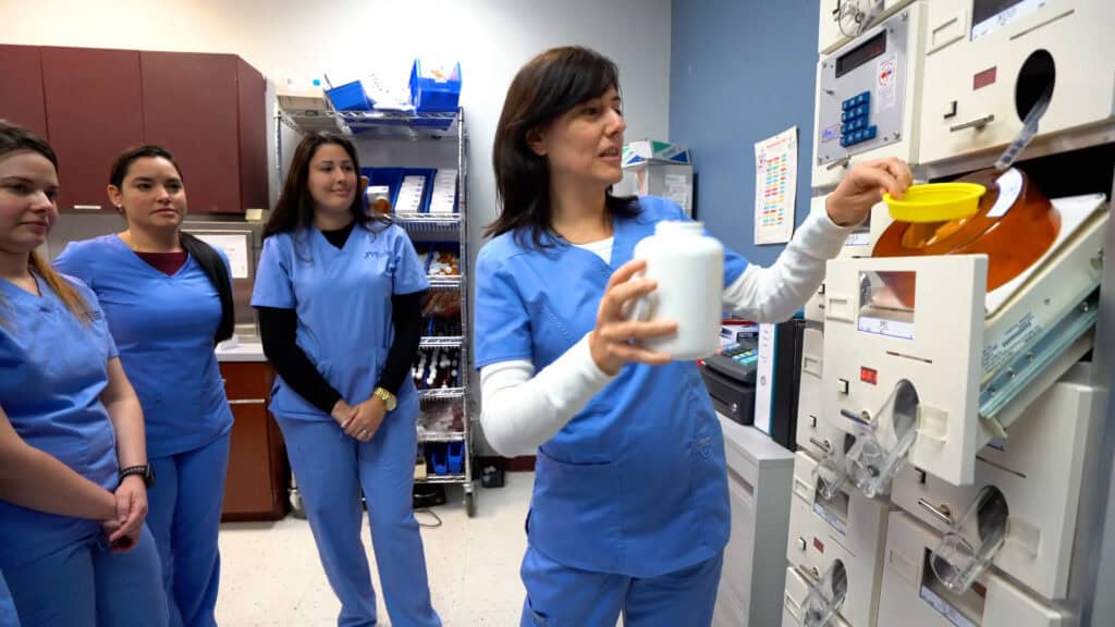 Miami pharmacy technician student hands on training with other students