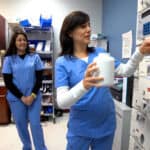 Miami pharmacy technician student hands on training with other students