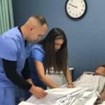 FVI Miramar nursing assistant school - home health aide school students participate in a a nursing assistant lab