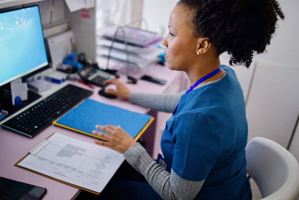 flordida nurse working at the reception desk in the private clinic