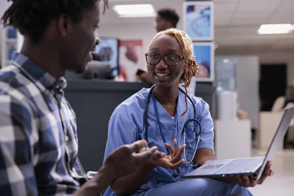 florida nurse consulting patient at clinic