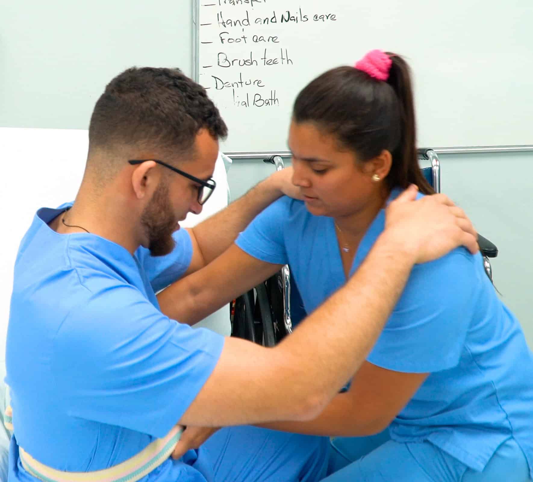 Miami patient care tech training: student practicing with gait belt