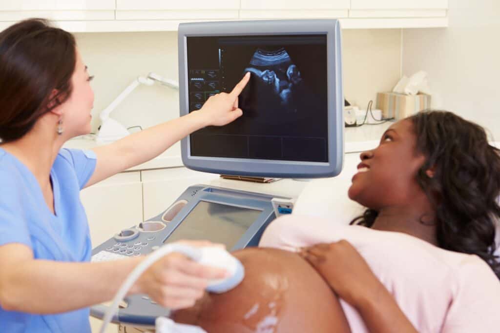 Florida DMS technician taking ultrasound with pregnant patient