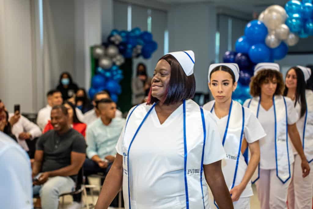 FVI Miami ASN nursing degree program graduates walking into their Pinning Ceremony