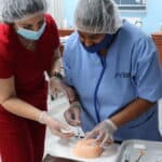 miami patient care tech program student practicing her injections