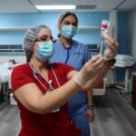 instructor showing miramar nursing school student how to set up an injection