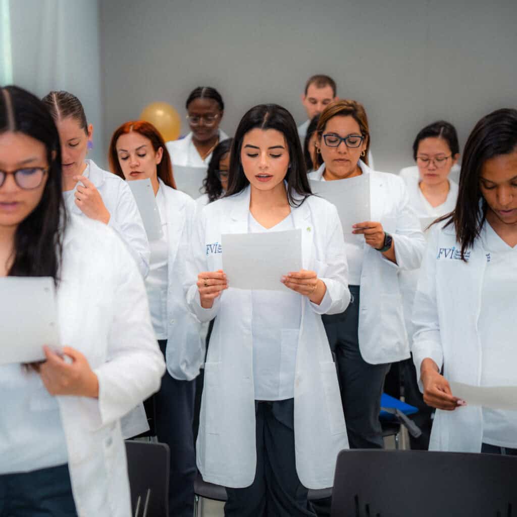 FVI nursing students reading a pledge at a nursing orientation