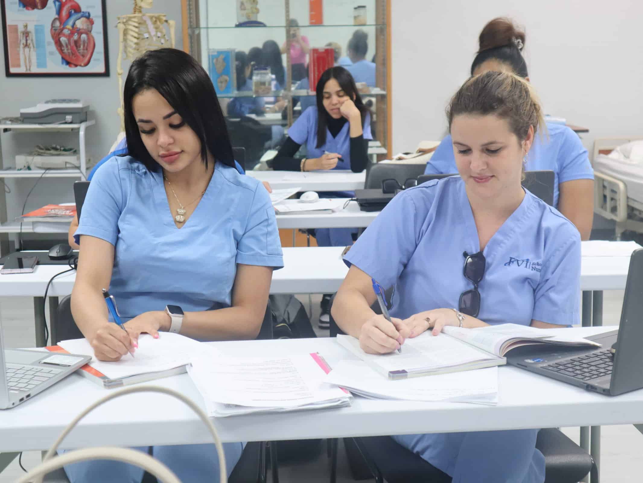 2 FVI allied health students studying in class