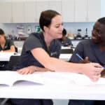 nursing students working together in the classroom