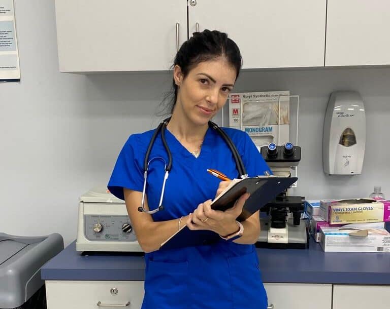 Miami medical assistant program student practicing skills