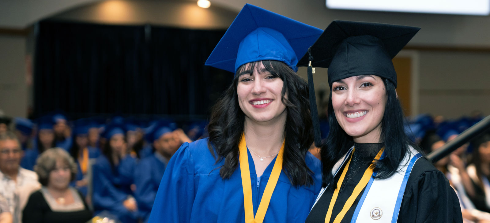 Two FVI graduates at a ceremony 