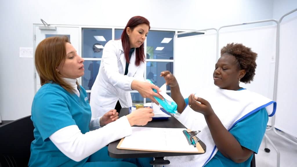 Miami patient care tech program students practicing patient care