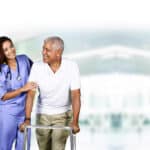 home health aide working with elderly man