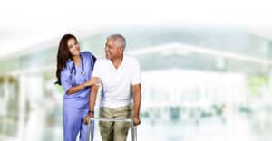 home health aide working with elderly woman