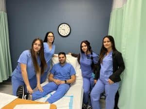 licensed practical nursing students hands on training with instructors in miami fl